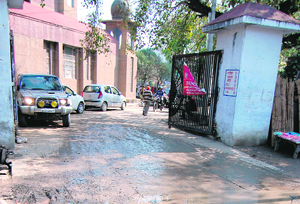 Overflowing sewage water poses problems for patients and their attendents outside the Jallianwala Bagh Memorial Civil Hospital in Amritsar on Wednesday. 