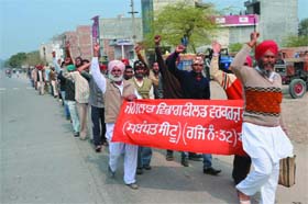Employees of the Forest Department staging a rally in the city