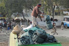 Security beefed up: A policeman unloads his bedding at the Police Lines in Bathinda on Wednesday