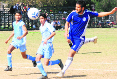 Players in action during a football match held at Panjab University, Chandigarh, on Wednesday. Tribune Photo: Parvesh Chauhan