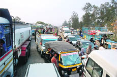 A traffic jam near Jandli bridge on the National Highway No. 1 in Ambala during the Bharat bandh on Wednesday. 