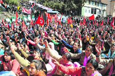Activists of the All-Trade Unions raise slogans during a two-day strike called by trade unions in Shimla on Wednesday.