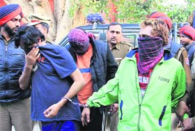 The three accused in the money changer kidnapping and murder case in police custody in Jalandhar on Wednesday