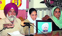 Family members of deceased JE Harbhajan Singh address mediapersons in Jalandhar on Wednesday