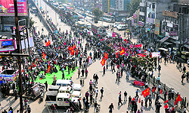 Protesters block a road outside the inter-state bus terminus in Ludhiana on Wednesday