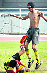 Players during football trials at Guru Nanak Stadium in Ludhiana on Wednesday