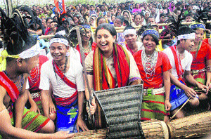 BJPs Samriti Irani holds Garo warrior sword during her visit to East Garo Hills.