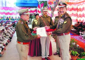 Kripa Ram (right), ITBP General, North West Frontier, honours an officer on the frontiers seventh raising day in Chandigarh on Wednesday