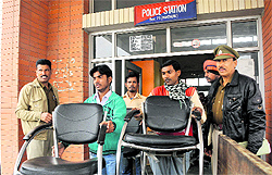 Police officials oversee the shifting of furniture from a makeshift police station being run from a community centre in Phase VII, Mohali, on Thursday