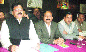 Ashok Verma, Leader of the Opposition in the Dehradun Municipal Corporation, along with Congress legislator Raj Kumar, addresses a press conference in Dehradun on Thursday.
