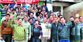 Employees of the banking sector stage a protest at Ranipur in Haridwar on Thursday.