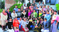 A group photo of the winners of the Haryana state science exhibition with the Principal of GVM Girls College, Dr Jyoti Juneja, and other teachers on the college premises. Photo: BS Malik