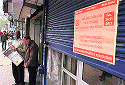 A strike pamphlet on the shutter of a bank on the Residency Road in Jammu on Thursday