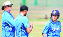 Sachin Tendulkar and Harbhajan Singh with coach Duncan Fletcher during a practice session.  PTI 