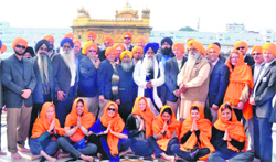 Members of the California Agricultural Leadership Foundation pay obeisance at the Golden Temple on Friday. A Tribune Photo