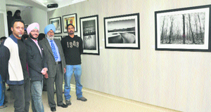 Justice SS Sodhi (second from right), a former Chief Justice of the Allahabad High Court, with photographers Idris Ahmed, Angad B Sodhi and Mathew Kurien at "Living the Dream", a group photography exhibition, in Sector 9, Chandigarh, on Friday.