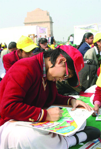 Schoolchildren take part in a painting competition during the Delhi Police Week-2013 in New Delhi on Friday.