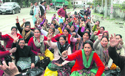ANM workers hold a protest in support of their demands in Dehradun on Friday. Tribune photo: Vinod Pundir