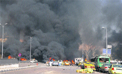 Flames and smoke rise from cars after a huge explosion in central Damascus, Syria, on Thursday.  AP/PTI