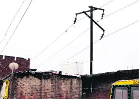High-tension wires run parallel to houses at Indira colony which has seen several related accidents in the past few years