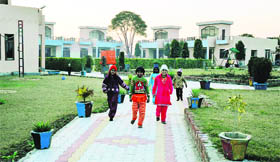 The children live in family houses spread over 1.75 acres.
