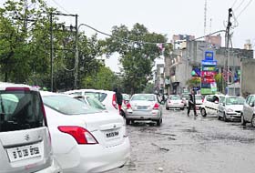 Vehicles parked on a service lane at Ferozepur Road in Ludhiana on Saturday