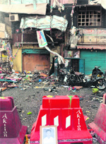 A photograph of a victim placed at the scene of the bomb blasts at Dilsukhnagar in Hyderabad on Saturday. AFP