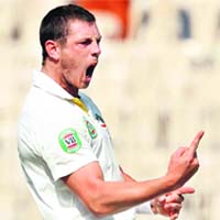Australias James Pattinson celebrates the wicket of Cheteshwar Pujara