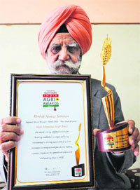 Manmohan Singh Verka shows the award in Amritsar on Sunday. 