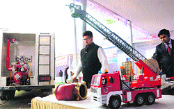 People look at a model of a fire brigade truck at an exhibition organised by Micro, Small and Medium Enterprises Department in Karnal on Saturday. Tribune photo: Ravi Kumar