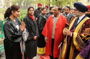 Education Minister Sikander Singh Maluka (right) is greeted by a teacher at Rajindra College.