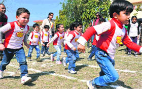 Students of Euro Kids School take part in a fun race held at the Bhalla College ground in Haridwar on Sunday.