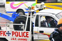 Wearing of seatbelts in four-wheelers, though mandatory, is a rule followed more in breach. Tribune photo: Anand Sharma