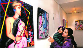 Viewers enjoy an art exhibition at the Virsa Vihar in Jalandhar on Sunday.