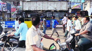People at the site of the bomb blast at Dilsukh Nagar in Hyderabad on Saturday.