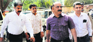 Police officers Bharat Patel and Tarun Barot outside a court on Sunday.