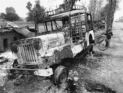 A jeep set on fire by the armed cadres of the Peoples Liberation Front of India during an indefinite strike announced by the organisation in Latehar district of Jharkhand on Saturday. 