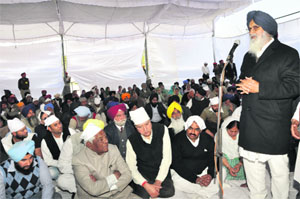 Chief Minister Parkash Singh Badal addresses a gathering in Dasuya on Sunday. 