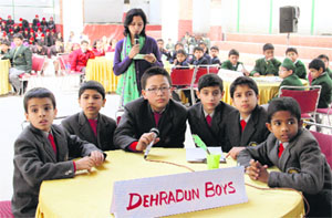Young students participate in a science quiz held in Dehradun on Monday.