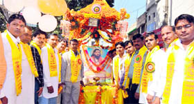 Devotees hold a procession on the occasion of the birth anniversary of Saint Ravidas in Haridwar on Monday.