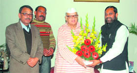 Bhagvat Prasad Makwana, chairman of the State Safai Karamchari Commission, meets Governor Aziz Qureshi in Dehradun on Monday.