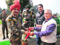 Col Ajai Sharma, Commanding Officer, Jammu Terriers, being felicitated by the sarpanch of Gowar village in Pargwal sector in Jammu on Monday. 