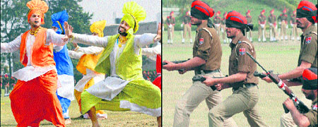 Police jawans perform bhangra during the 158th passing-out parade at the PAP grounds; and (right) having been blindfolded, jawans prepare to strike a target on the occasion in Jalandhar on Monday.