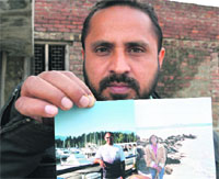 Gurinder Singh Grewal, shows a picture featuring Jaswant and his sister Gurpreet, in Ludhiana. 