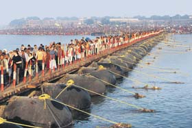 Devotees arrive to take a holy dip at Sangam on the occasion of Maghi Poornima in Allahabad on Monday