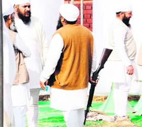 A member of the Namdhari group carrying a gun