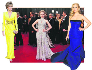 (L-R)Jane Fonda, wearing a yellow Versace gown. Amanda Seyfried in an Alexander McQueen dress. Reese Witherspoon in a strapless cobalt blue Louis Vuitton gown     