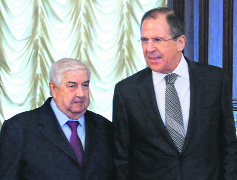 Russian Foreign Minister Sergei Lavrov (R) and his Syrian counterpart Walid al-Muallem in Moscow on Monday.