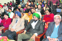 Inspector General of Police (Bathinda range) Nirmal Singh Dhillon (second from right) and vice-chancellor Dr Jai Rup Singh are all attention at the Foundation Day function. A Tribune photograph
