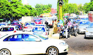 Vehicles stuck in a traffic jam on the Chandigarh-Panchkula road near NAC, Mani Majra, on Tuesday. 